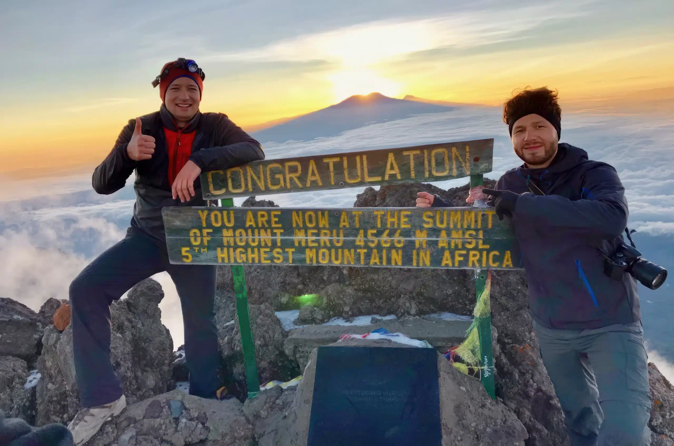 https://safehaventanzania.com/wp-content/uploads/2018/09/Hikers-at-the-Mount-Meru-Summit-Easy-Travel-Tanzania-scaled-1.webp